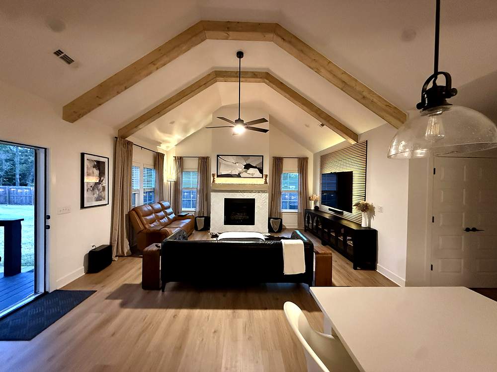 Great room with fireplace and exposed beams